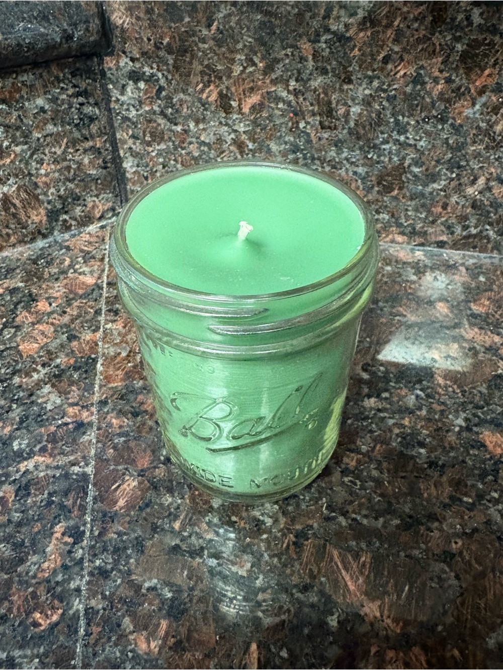 Handmade upcycled Green basil vanilla wax candle in a Ball jar
